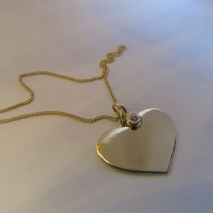 Heart-shaped pendant. I love you necklace.